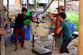 3 Men Moving Bulk Fish Product Manually.jpg
